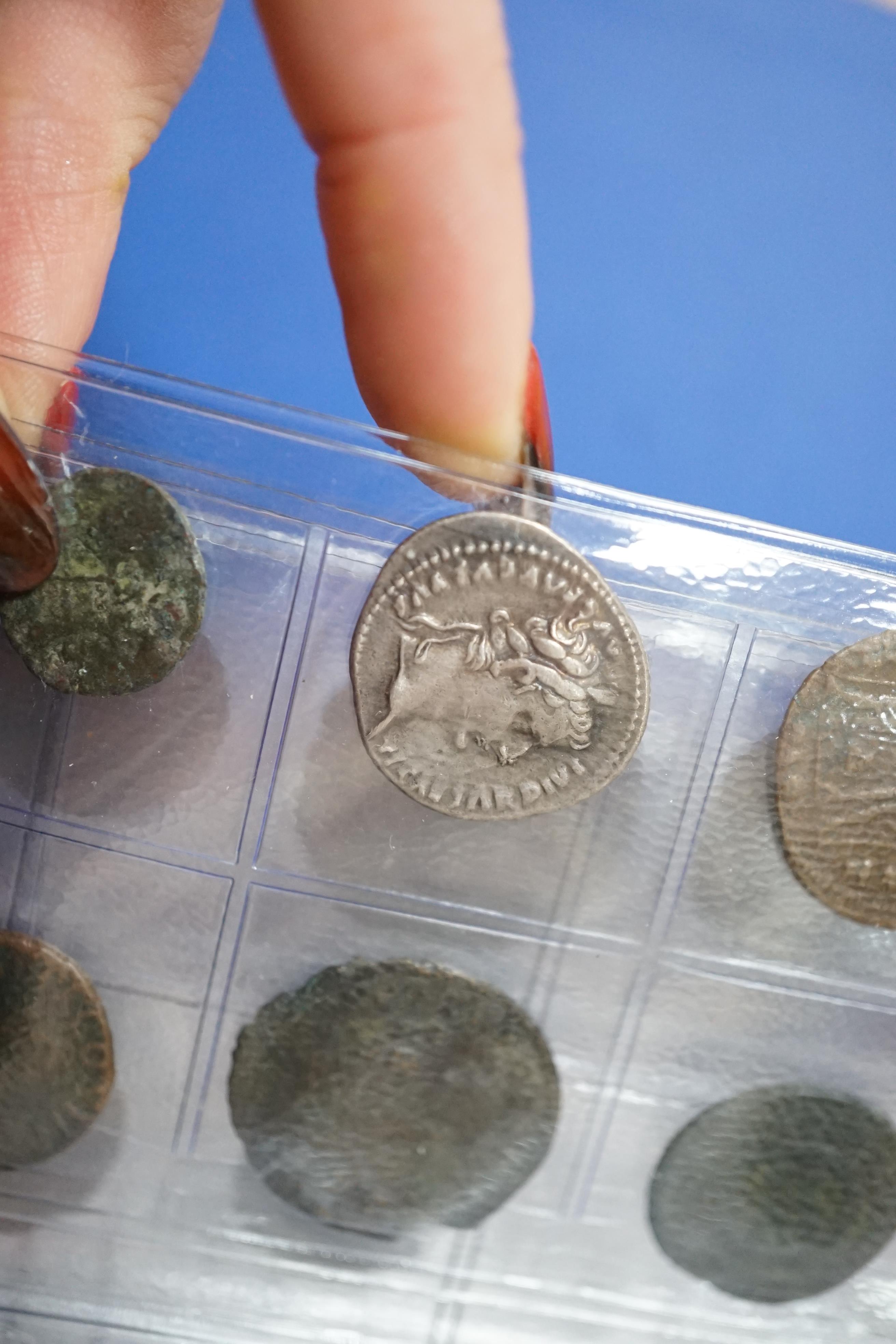 A large collection of Roman AE and AR coins, in an album